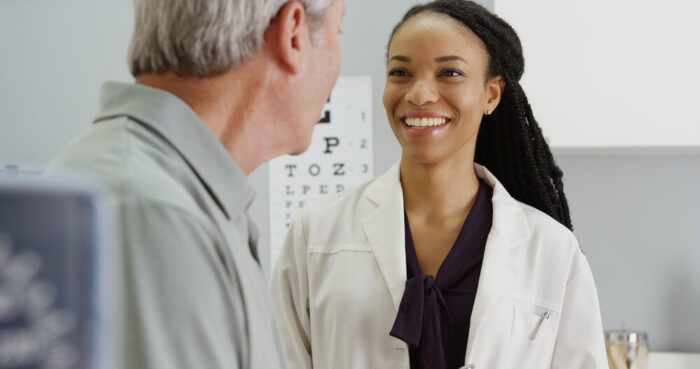 Doctor talking to a patient after eye exam